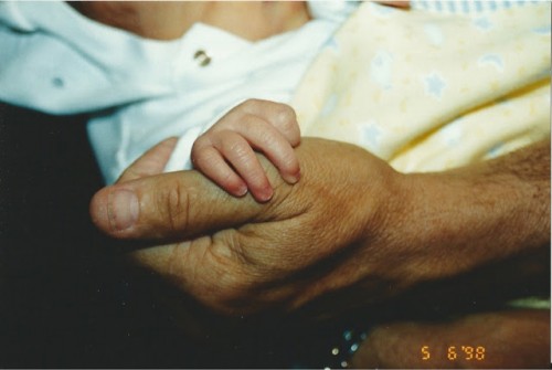 PHOEBE'S NEWBORN HAND HOLDER HER GRANDFATHERS HAND